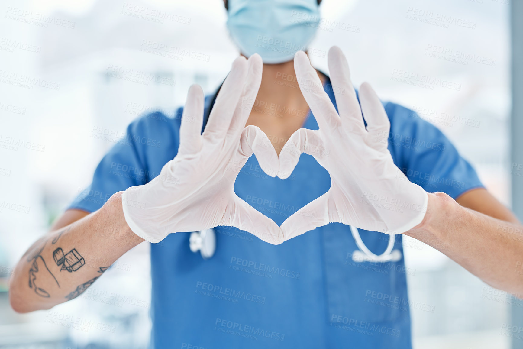 Buy stock photo Closeup shot of a medical practitioner making a heart shape with his hands