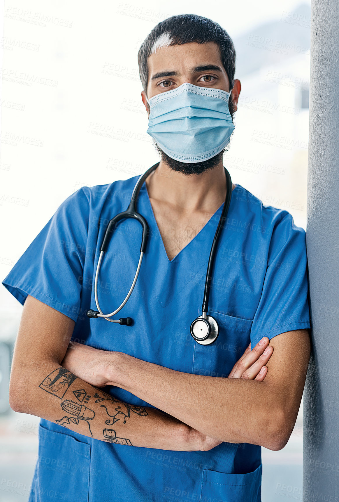 Buy stock photo Portrait of a medical practitioner wearing a face mask in a hospital