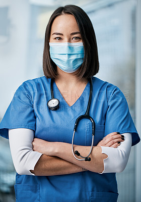 Buy stock photo Portrait of a medical practitioner wearing a face mask in a hospital