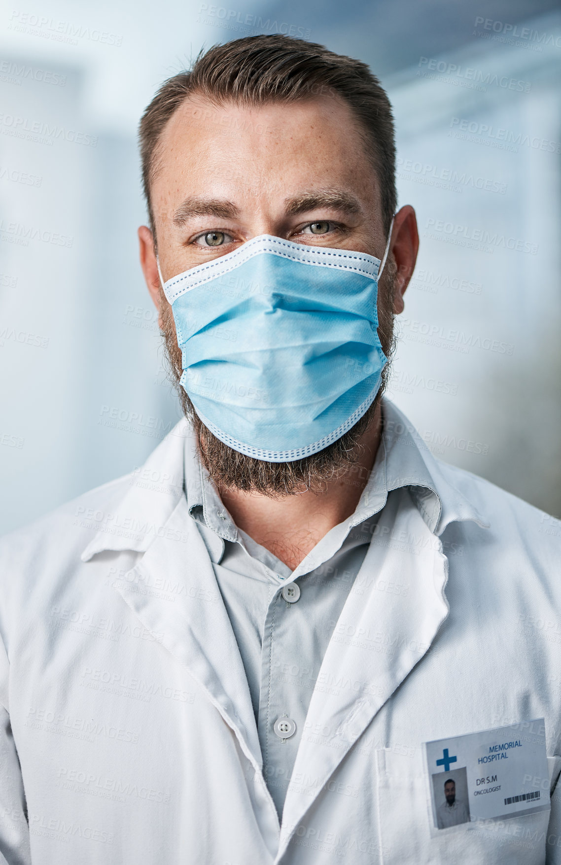 Buy stock photo Portrait of a medical practitioner wearing a face mask in a hospital