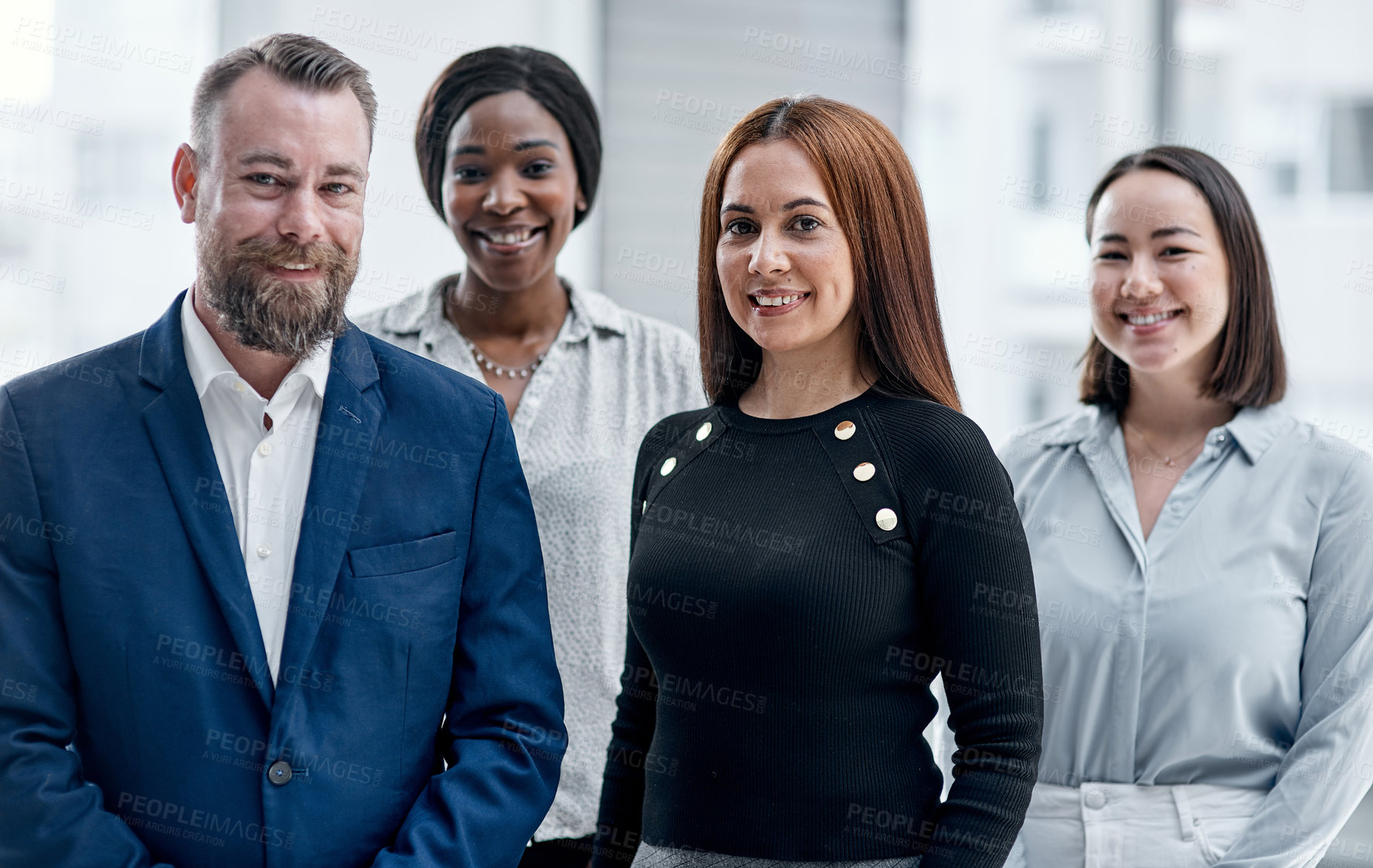 Buy stock photo Portrait of a group of businesspeople standing together in an office