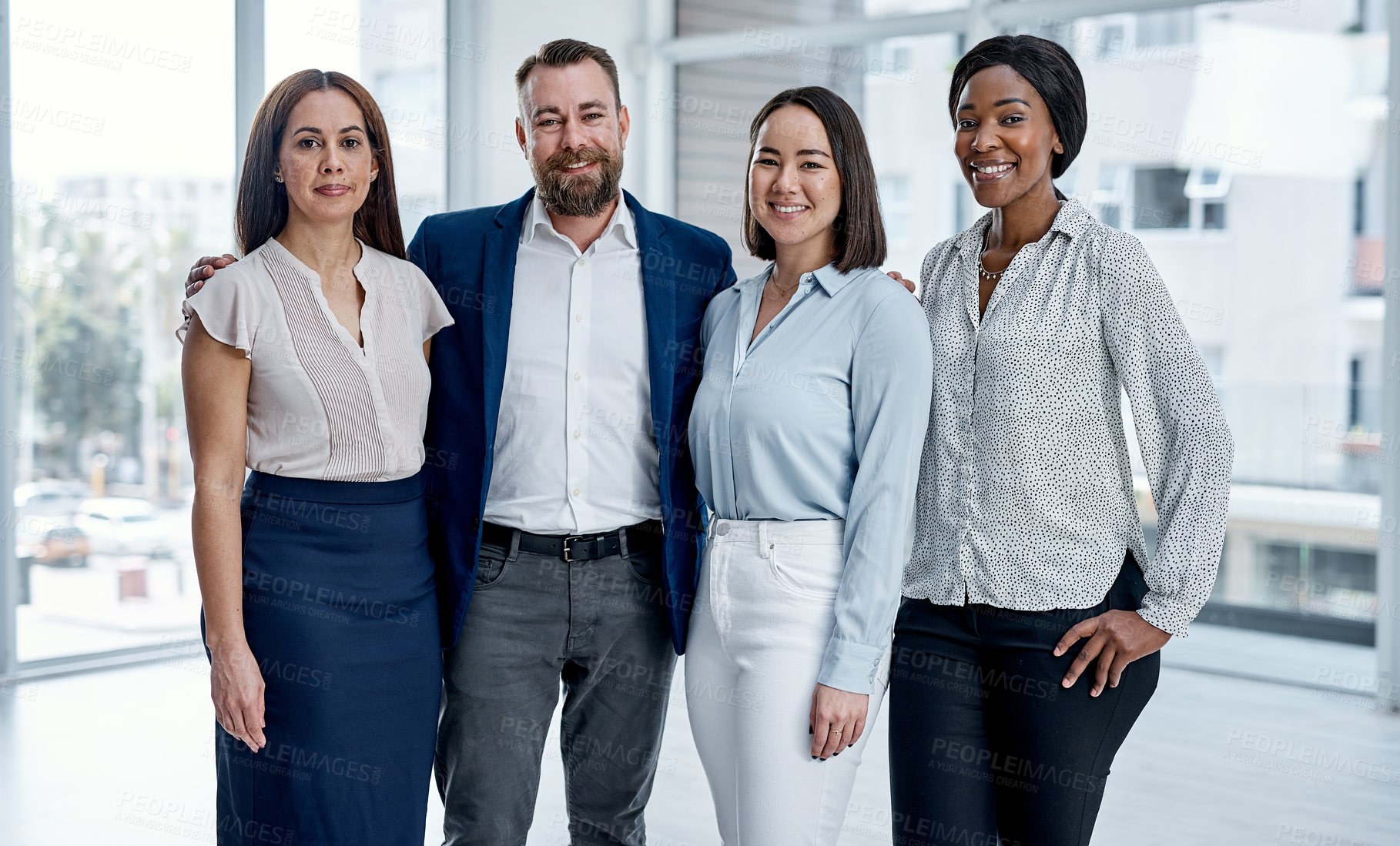 Buy stock photo Portrait of a group of businesspeople standing together in an office