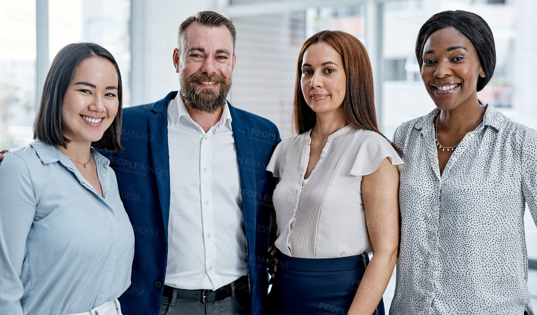 Buy stock photo Portrait of a group of businesspeople standing together in an office