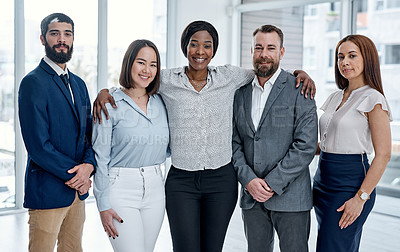 Buy stock photo Portrait of a group of businesspeople standing together in an office