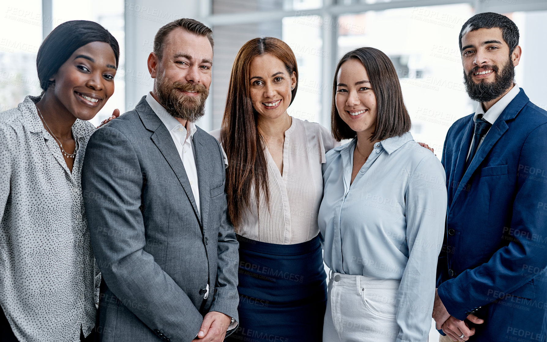 Buy stock photo Portrait of a group of businesspeople standing together in an office