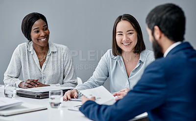 Buy stock photo Shot of a businesswoman having a meeting with her colleagues in an office