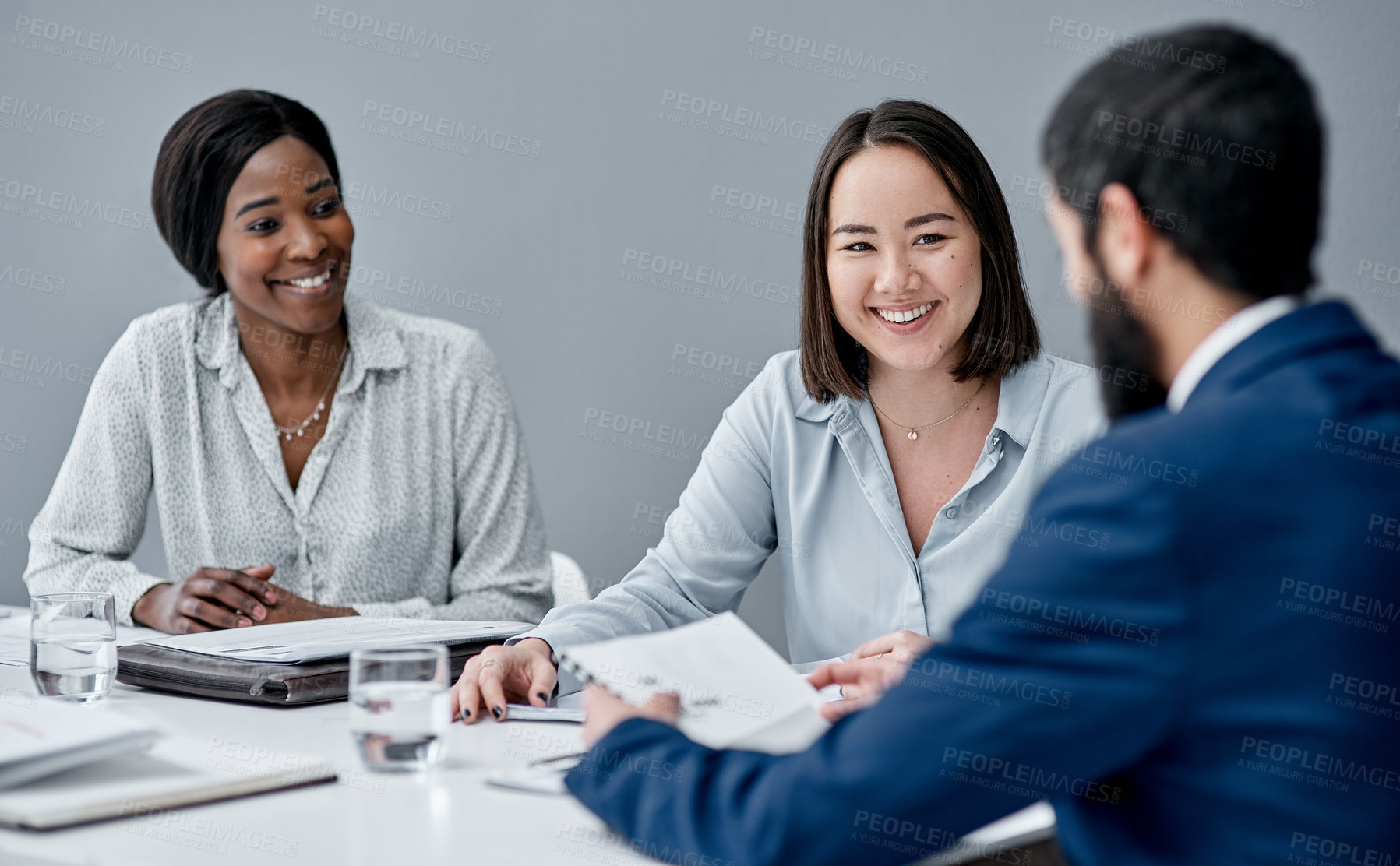 Buy stock photo Shot of a businesswoman having a meeting with her colleagues in an office