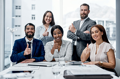 Buy stock photo Portrait of a group of businesspeople showing thumbs up together in an office