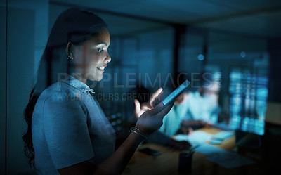 Buy stock photo Shot of a young businesswoman using a digital tablet during a late night at work