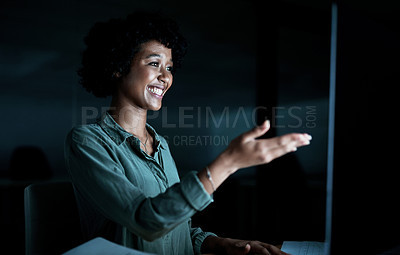 Buy stock photo Shot of a young businesswoman using a computer to make a video call during a late night at work