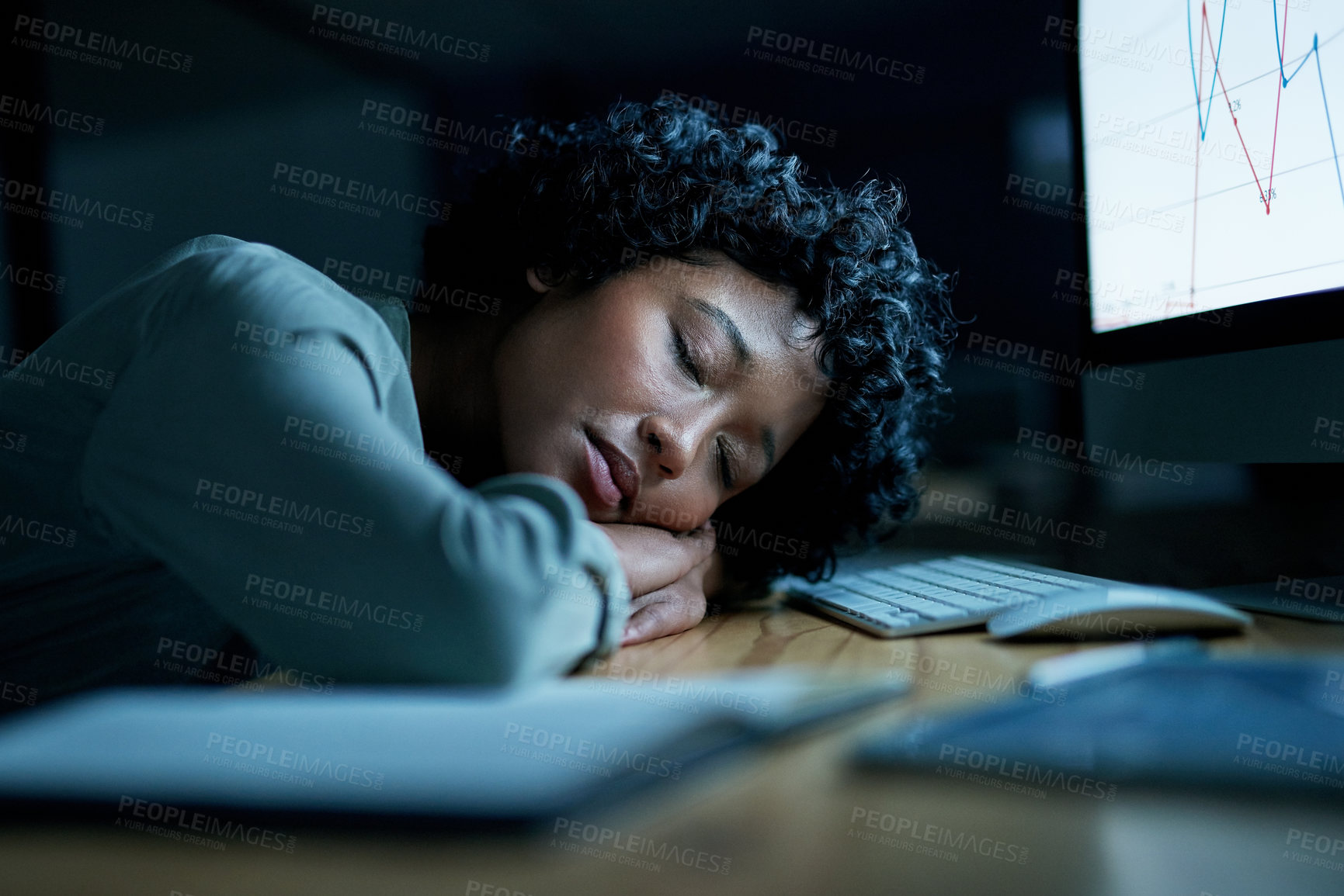 Buy stock photo Shot of young businesswoman sleeping at her desk during a late night in a modern office