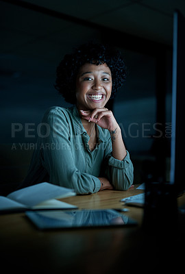 Buy stock photo Portrait of a young businesswoman using a computer during a late night at work