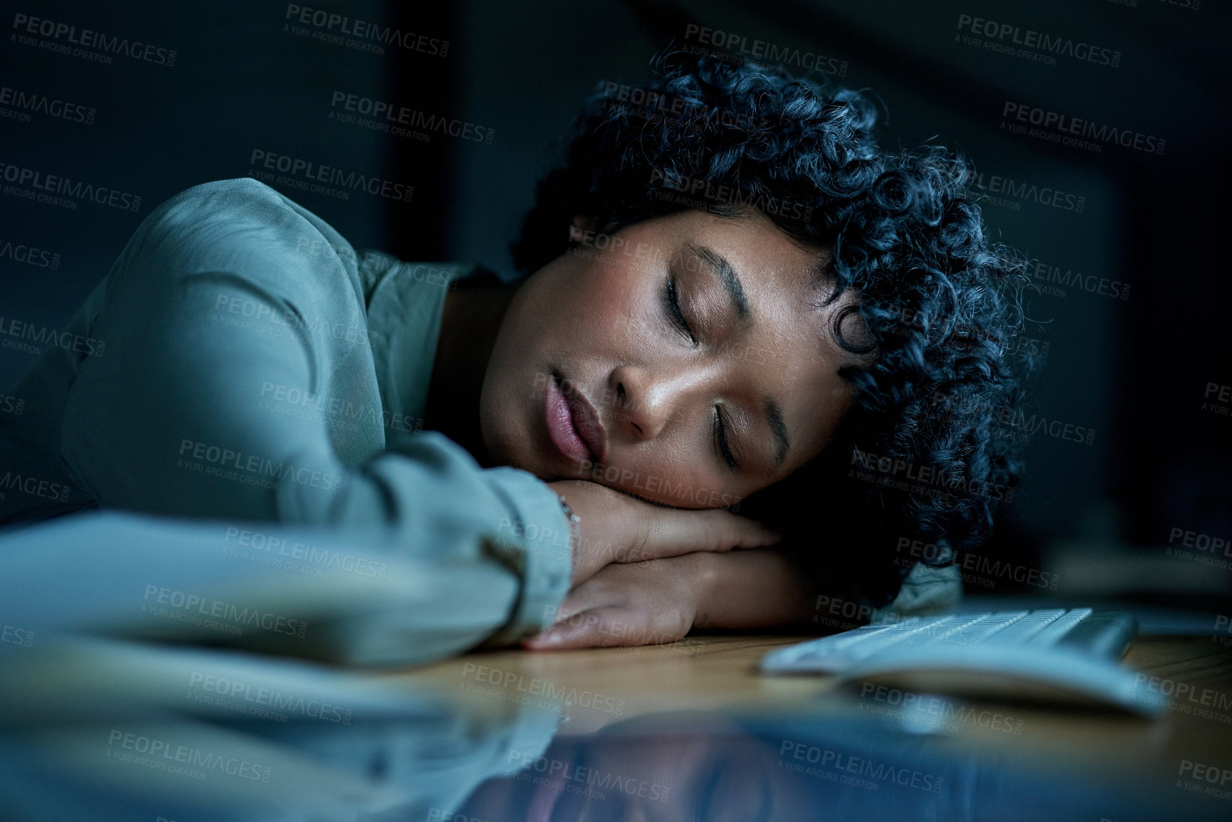 Buy stock photo Shot of young businesswoman sleeping at her desk during a late night in a modern office