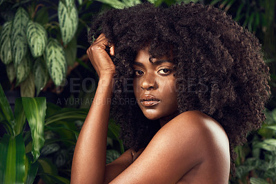 Buy stock photo Shot of a beautiful young woman posing against a leafy background