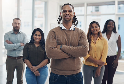 Buy stock photo Cropped portrait of a diverse group of businesspeople standing together in their office during the day