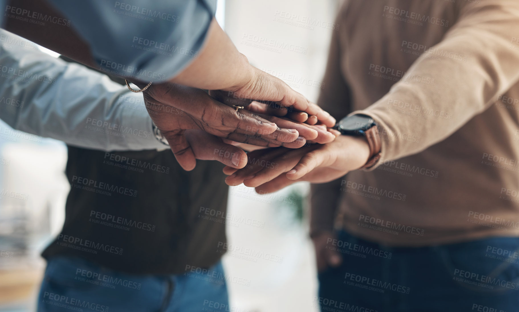 Buy stock photo Cropped shot of an unrecognizable group of businesspeople huddled with their hands piled together in the office