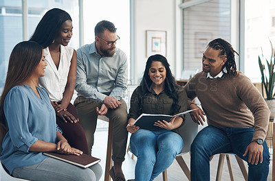 Buy stock photo Cropped shot of a diverse group of businesspeople sitting together and having a discussion in the office