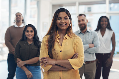 Buy stock photo Cropped portrait of a diverse group of businesspeople standing together in their office during the day