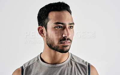 Buy stock photo Studio shot of a sporty young man posing against a white background