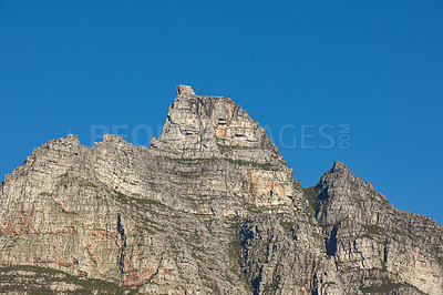 Buy stock photo Scenic landscape of Table Mountain in Cape Town, South Africa against a clear blue sky background from below with copy space. Beautiful panoramic of an iconic landmark and famous travel destination
