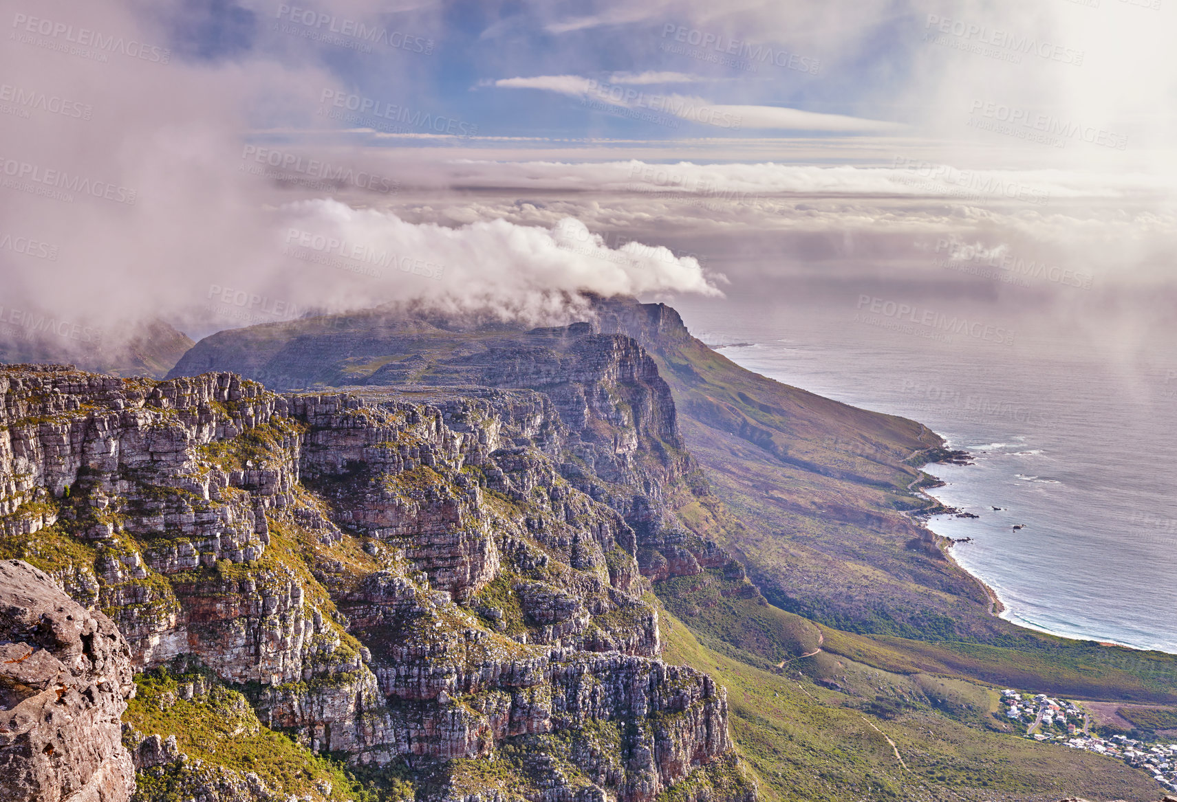 Buy stock photo Scenic landscape view of Table Mountain in Cape Town, Western Cape during summer. Beautiful scenery of clouds rolling over a natural landmark on a foggy and misty day in South Africa with copyspace