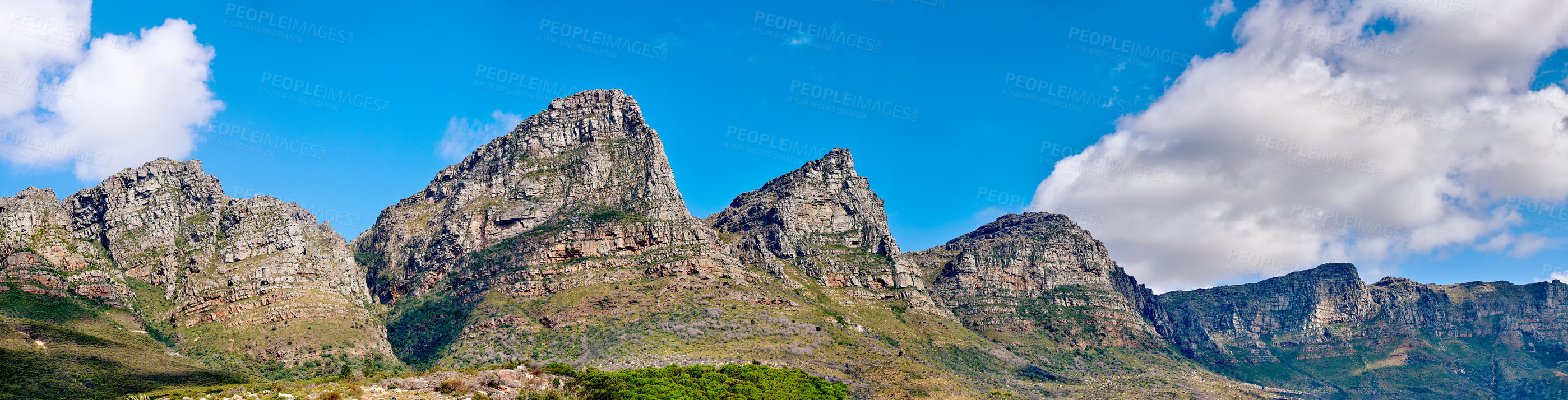 Buy stock photo Mountain landscape against a cloudy blue sky background with copy space. Rocky hills and cliffs on The twelve apostles in Cape Town, Western Cape. Beautiful travel destination and tourist attraction 