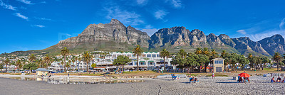 Buy stock photo View of Camps Bay promenade with green palm trees in summer is a great getaway for a vacation. Landscape of Table Mountain on a sunny day in Cape Town, South Africa looking beautiful with copy space.