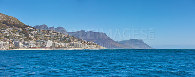 Buy stock photo Sea Point and the Twelve Apostles with Table Mountain in the background during summer in Cape Town, South Africa. Scenic banner landscape views of the ocean against a clear blue sky for tourism