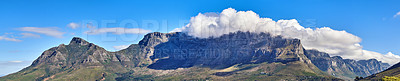 Buy stock photo Panoramic landscape of the majestic Table Mountain and Lions Head in Cape Town, Western Cape. A cloudscape sky with copy space over large mountainous and hilly terrain in wonderful nature