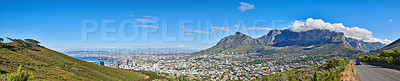 Buy stock photo Wide angle of Cape Town and mountain landscape on a sunny day. Beautiful view of a city against a blue horizon. A popular travel destination for tourists and hikers, on Table Mountain, South Africa