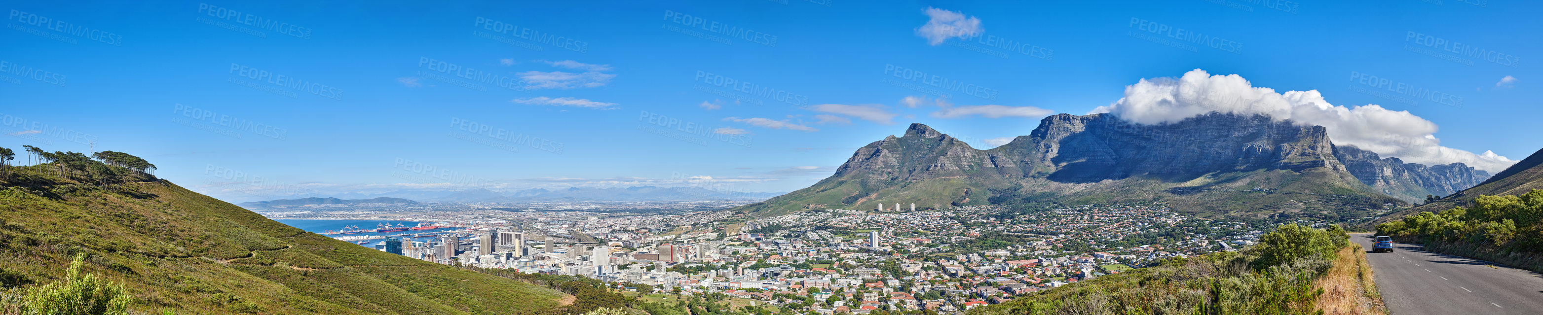 Buy stock photo Wide angle of Cape Town and mountain landscape on a sunny day. Beautiful view of a city against a blue horizon. A popular travel destination for tourists and hikers, on Table Mountain, South Africa