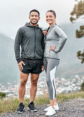 Buy stock photo Portrait of a sporty young man and woman exercising outdoors