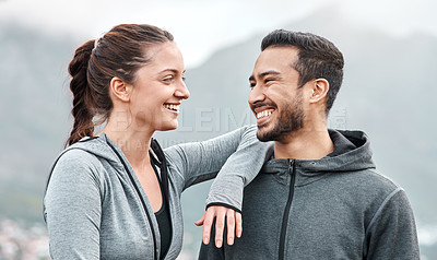 Buy stock photo Shot of a sporty young man and woman exercising outdoors