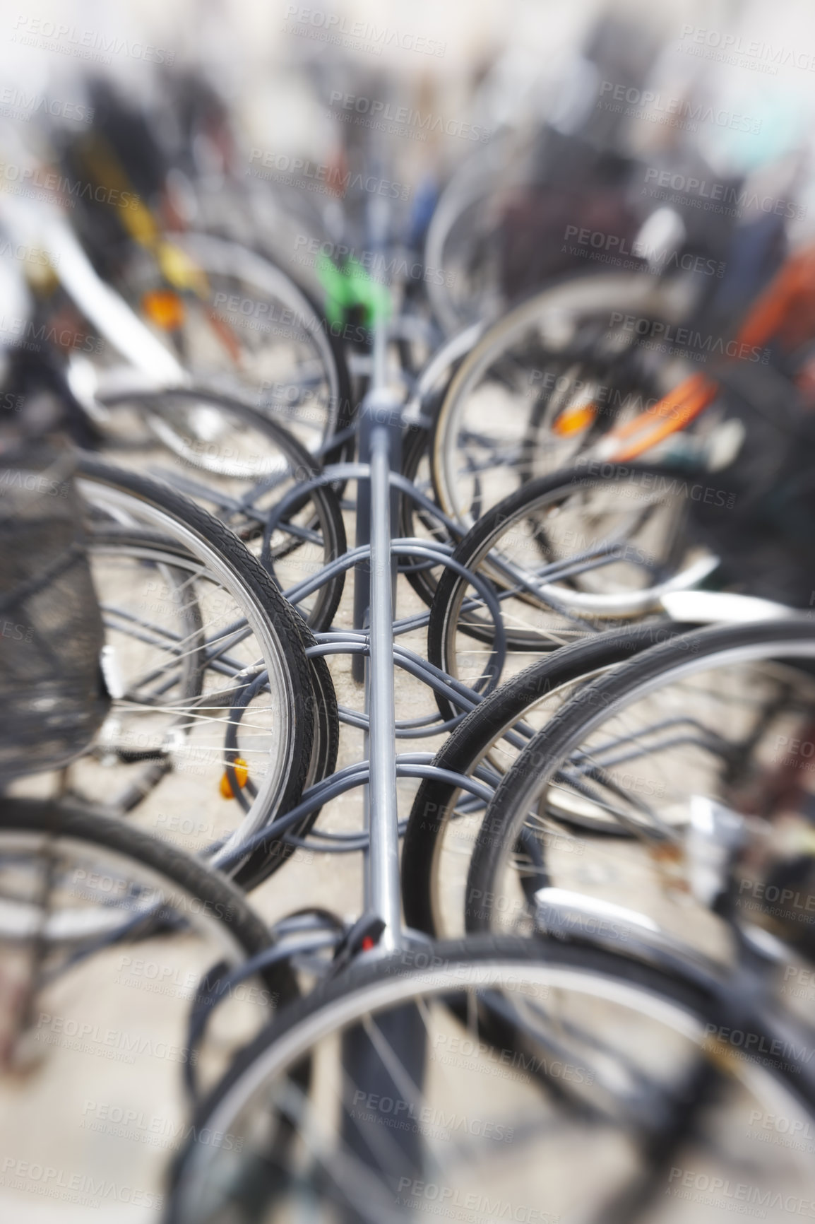 Buy stock photo A lens blurred photo of lots of parked bikes. Useful as background.