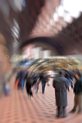 Buy stock photo Lens and dizzy motion blur of many people walking at a train station or subway with copy space and bokeh. A blurry crowd of travelers moving along a platform, arriving and departing from busy station
