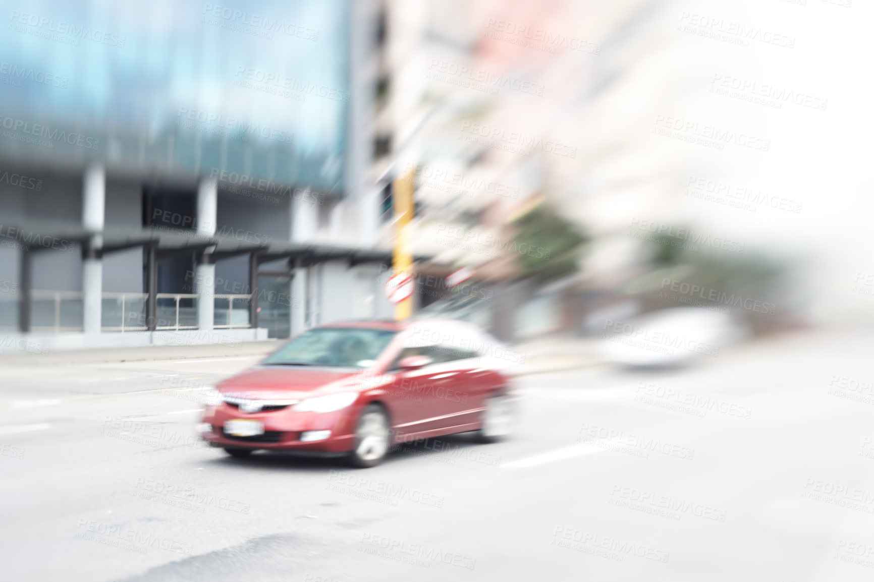 Buy stock photo A lens and motion blurred image of a car in the city