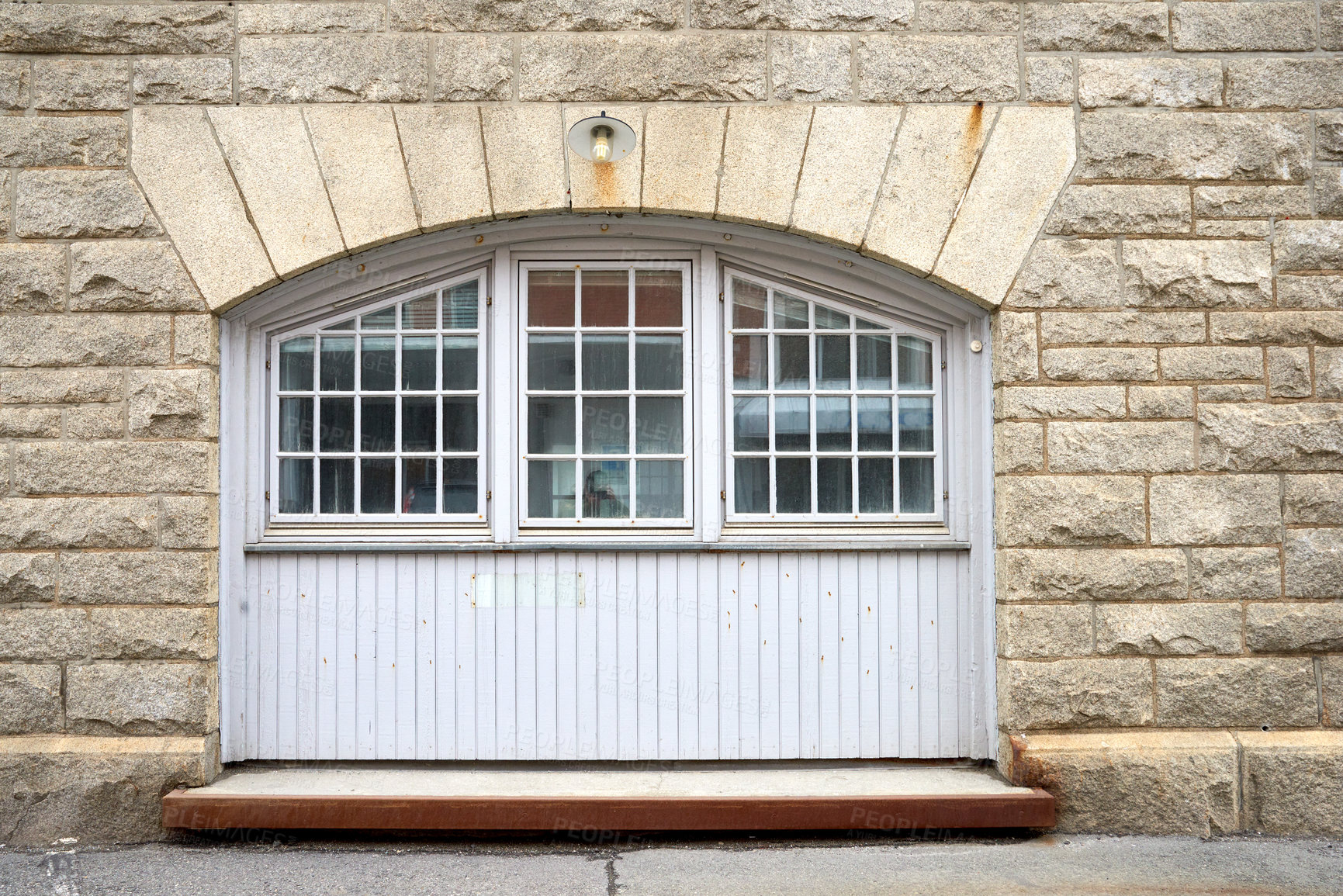 Buy stock photo Architecture of an old window in a brick wall. Facade of vintage white or classic windows on a house. Exterior details of a traditional, rustic residential building with light stone walls