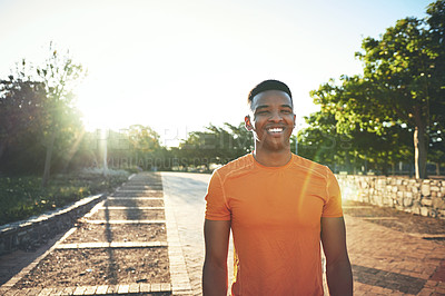 Buy stock photo Cropped shot of a young man smiling while our for a workout