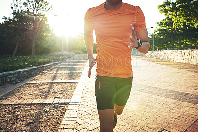 Buy stock photo Cropped shot of a young man out for a run