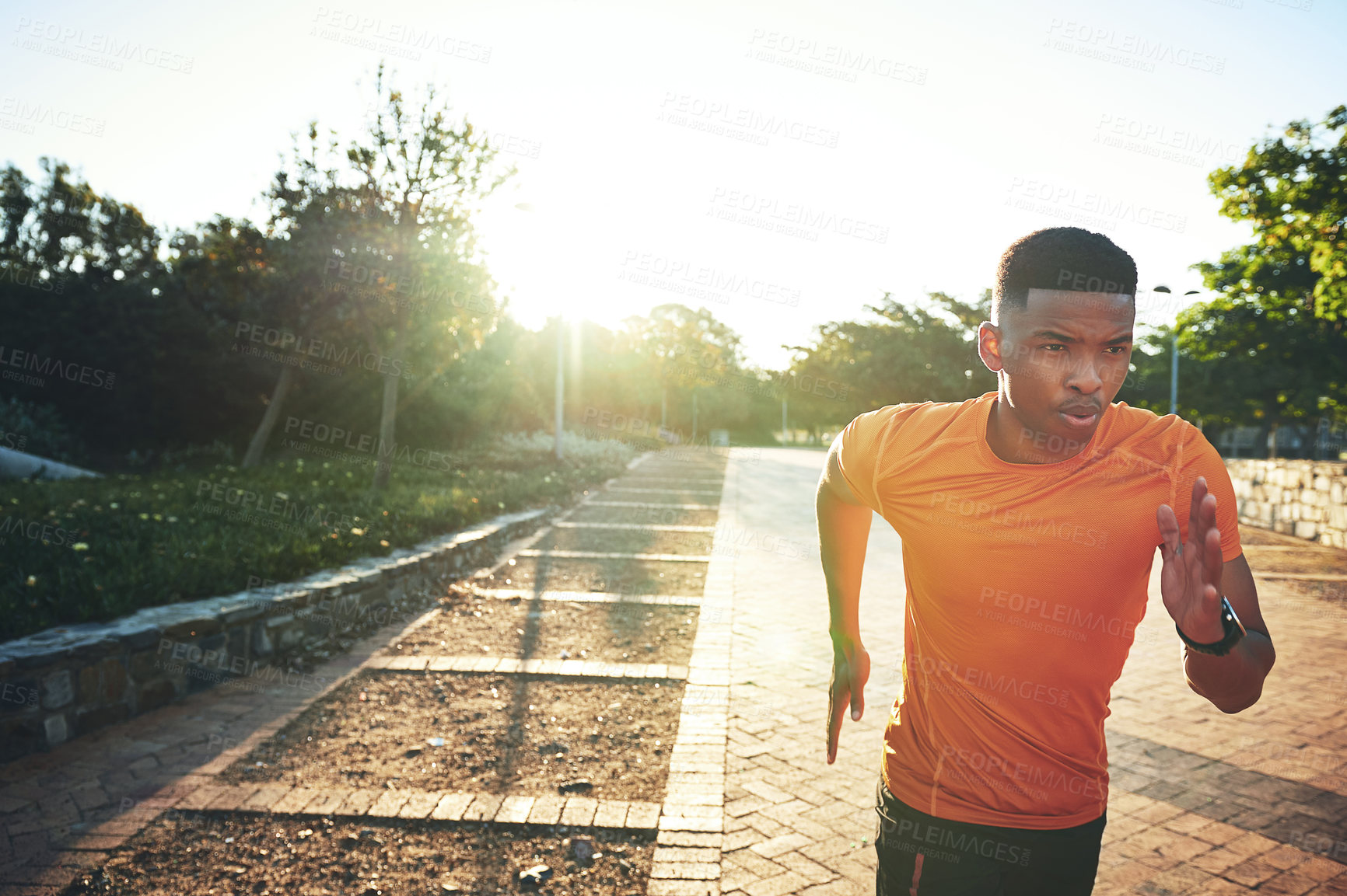 Buy stock photo Cropped shot of a young man out for a run