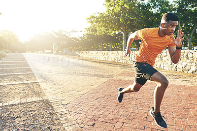Buy stock photo Shot of a young man out for a run