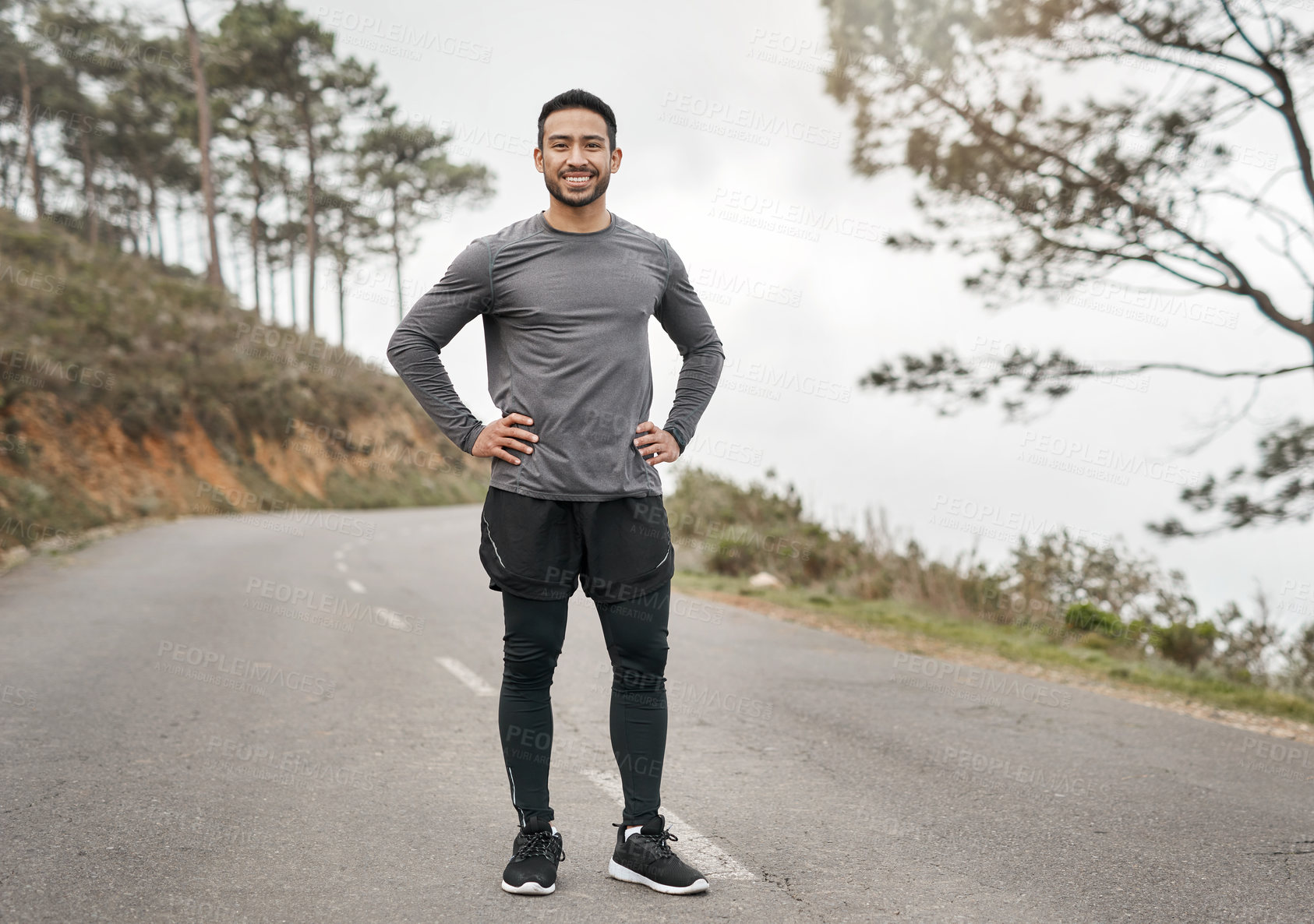 Buy stock photo Full length portrait of a handsome young man standing alone after his run outdoors