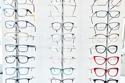 Buy stock photo Glasses, optometrist and shelf with new, trendy and colorful spectacles in a display window in the retail and eye care industry. Window shopping eyewear on showcase in an optometry or optical store
