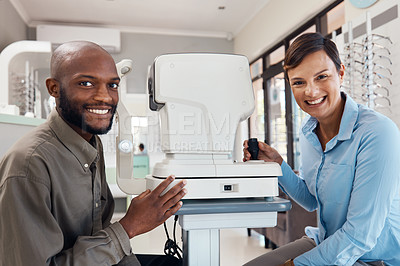 Buy stock photo Shot of an optometrist examining her patient’s eyes with an autorefractor