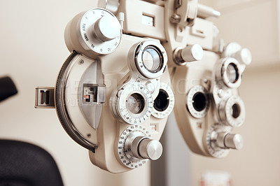 Buy stock photo Shot of an optical refractor in an optometrist’s office