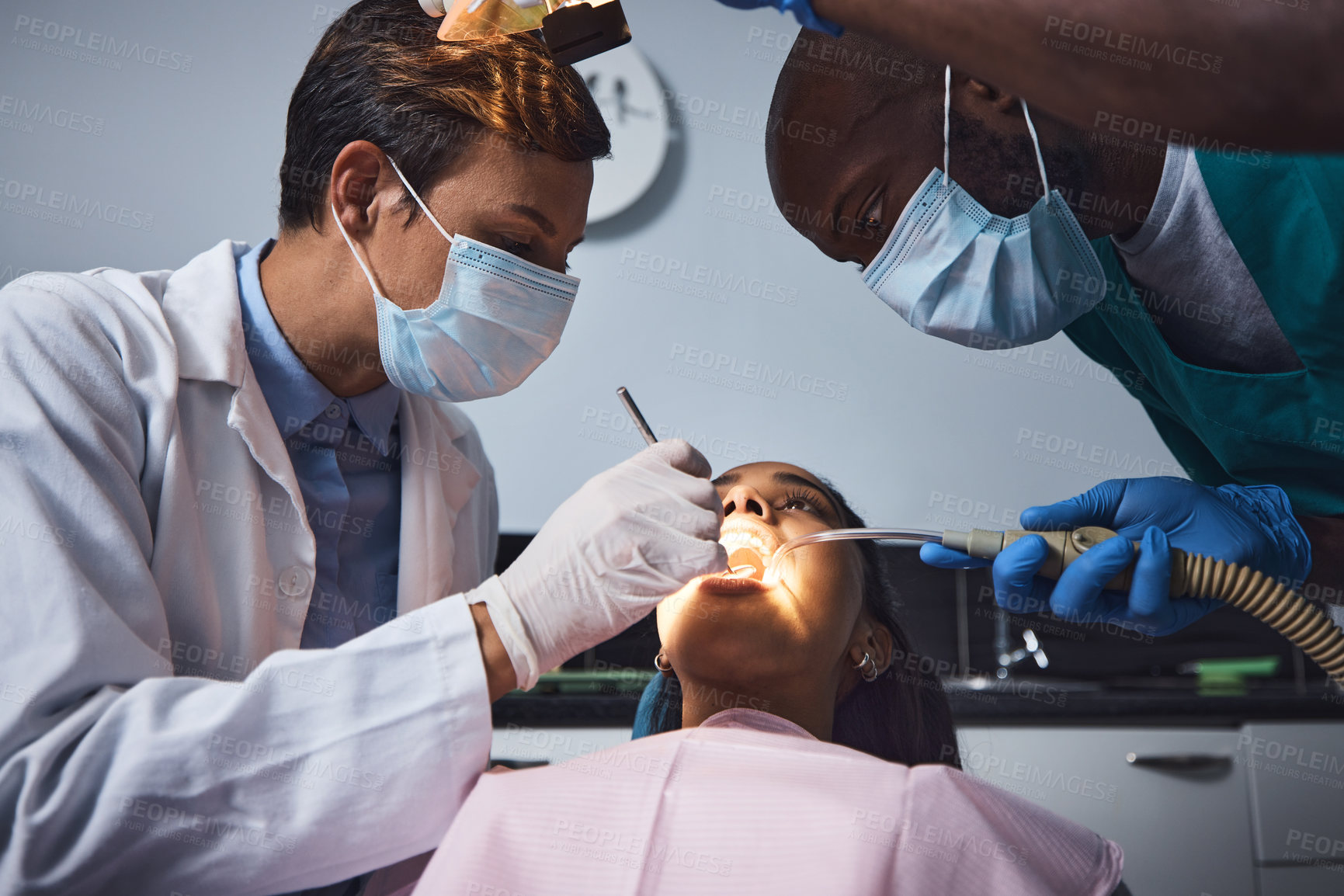 Buy stock photo Shot of a young woman having dental work done on her teeth