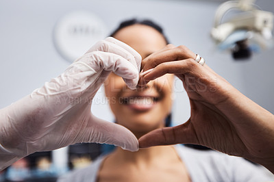 Buy stock photo Cropped shot of a dentist and patient making a heart shaped gesture with their hands