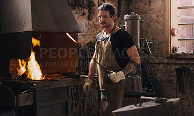 Buy stock photo Blacksmith, man and fire with metal rod, flame and equipment for professional craft. Protection, apron and gloves in workshop with anvil for metalwork, hammer and forge for iron product creation