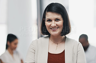 Buy stock photo Portrait of a confident young businesswoman having a team meeting in a modern office