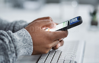 Buy stock photo Cropped shot of an unrecognizable businessman sitting alone in the office and using his cellphone